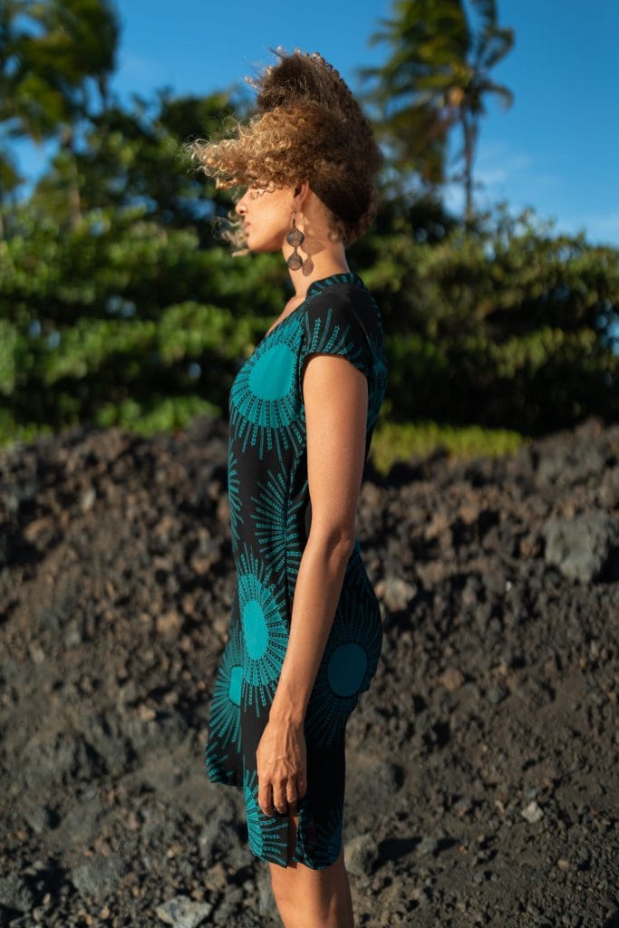 Female model wearing Kaohe Dress in Black/Teal - Side View