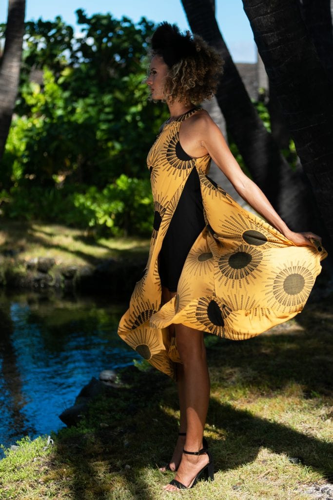 Female model wearing Kawehilani Dress in Kanehoalani Pattern - Side View