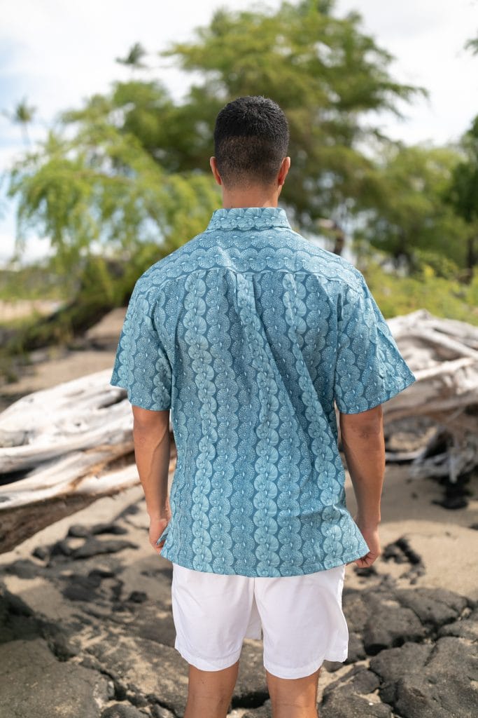 Male model wearing Mahalo Shirt S-S in a Lei Kupee Print and Blue Tint/Real Teal - Back View