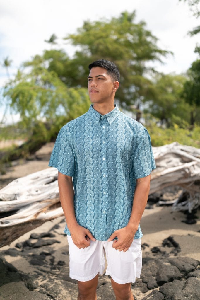 Male model wearing Mahalo Shirt S-S in a Lei Kupee Print and Blue Tint/Real Teal - Front View